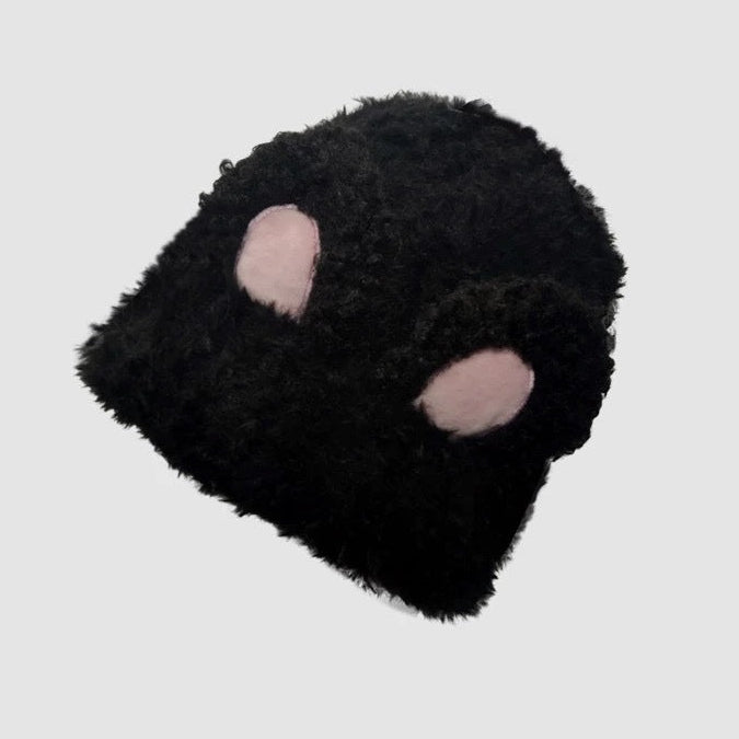 Black plush mask with pink accents on a light gray background, featuring the brand 'Changxiang'.